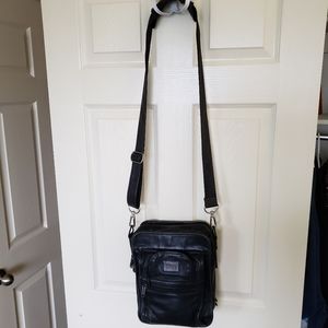 Tumi vintage leather shoulder travel bag.